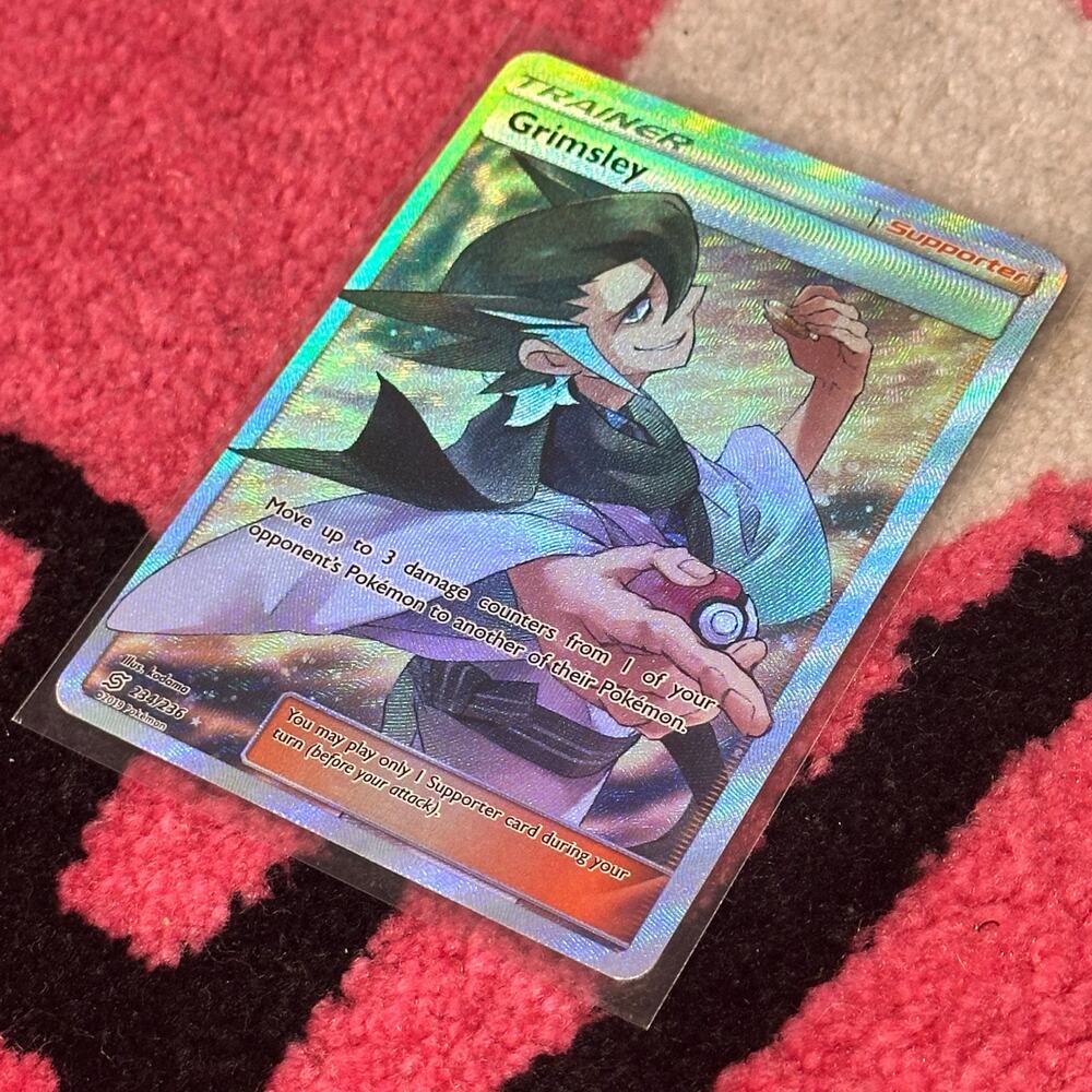 Grimsley #234 – Pokémon TCG Unified Minds – As Pictured